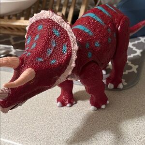 Red Dinosaur Toy with Blue Accents